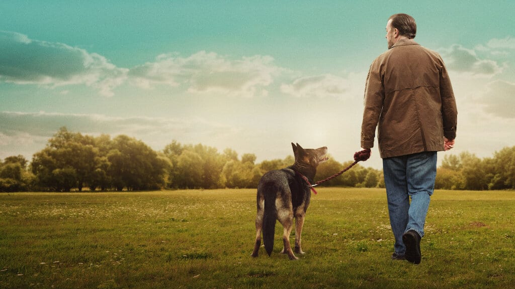 ricky-gervais-and-his-dog-walking-in-a-field