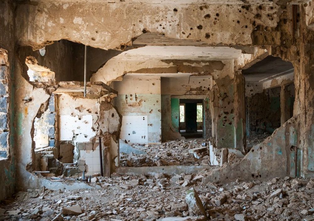 An image of a building ravaged by a bomb in Syria