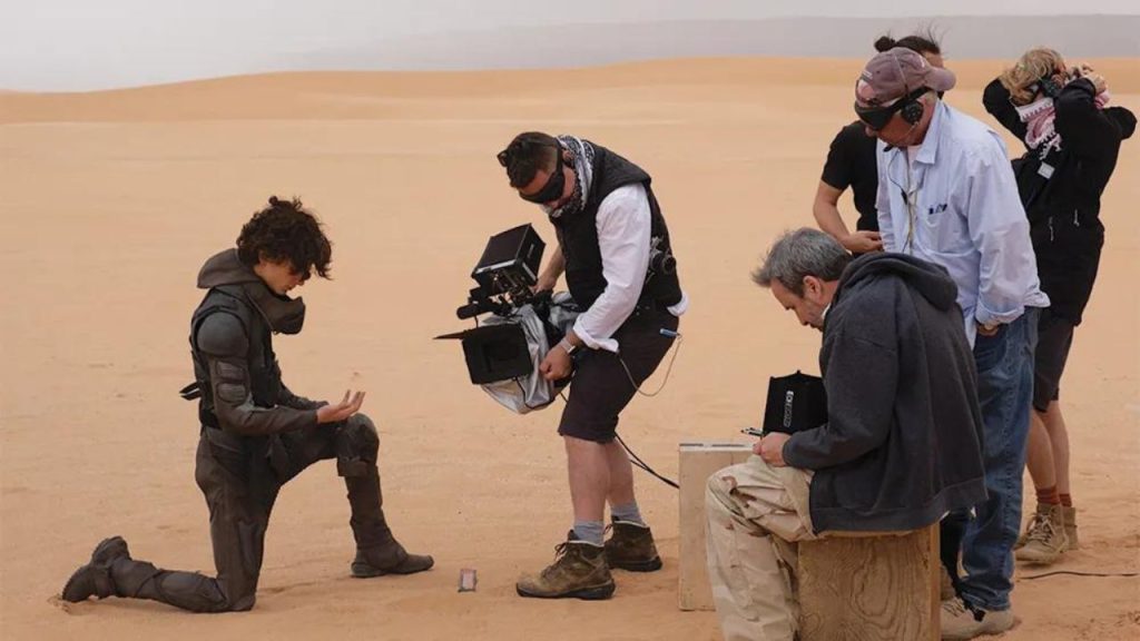 timothee chalamet with director and film crew on set for dune part two