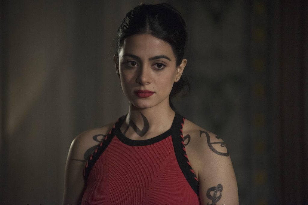 Isabelle Lightwood wearing a red top and red lipstick from Shadowhunters. 