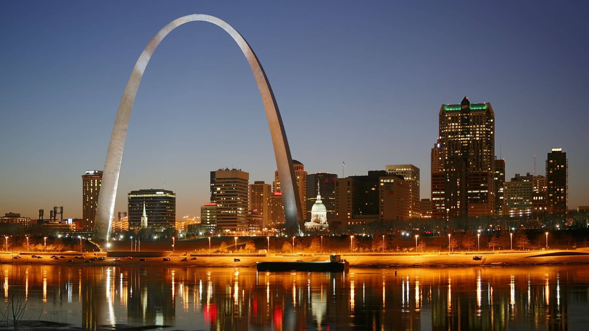 St. Louis nighttime skyline with the Gateway Arch in the foreground.