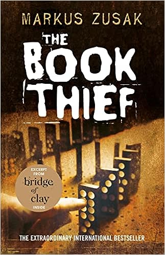 the book thief book cover hand knocking down a line of dominoes in dimly lit space