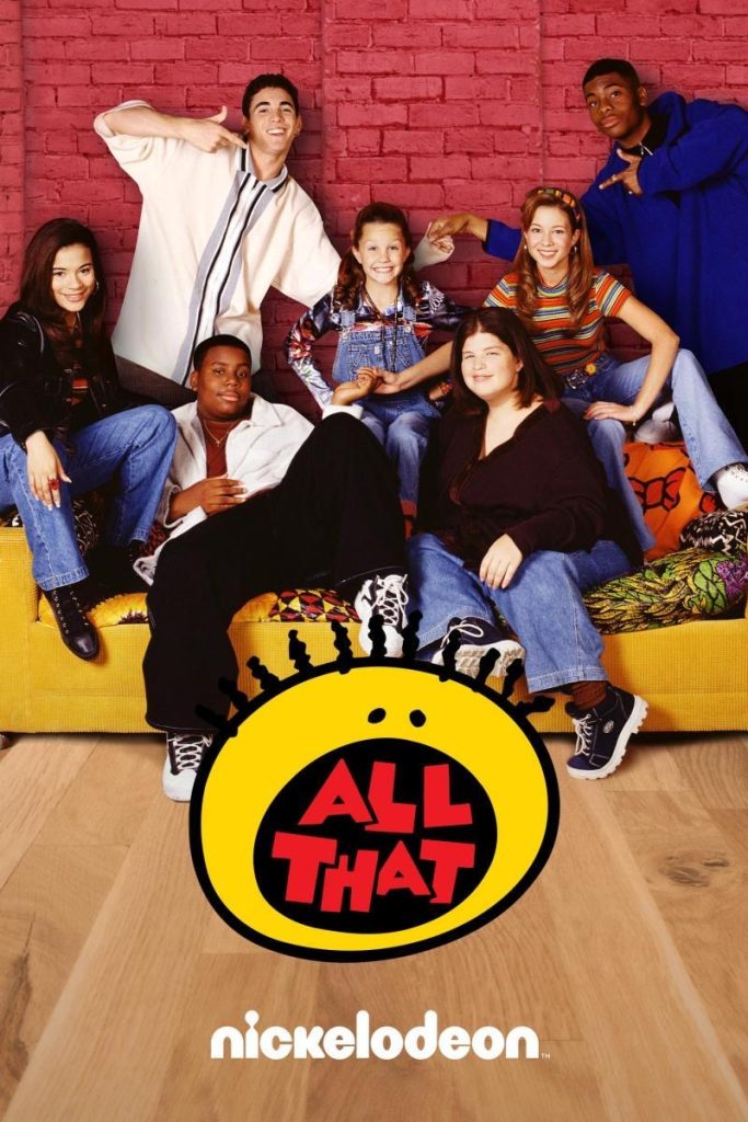 The cast of All that smiling while sitting on a yellow couch.