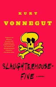 Slaughterhouse-Five by Kurt Vonnegut cover; yellow skull and crossbones with red background