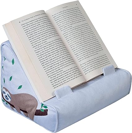 A gray comfy looking book holder with a sloth on the left hand side of it. The sloth is laying on a branch and around green leaves
