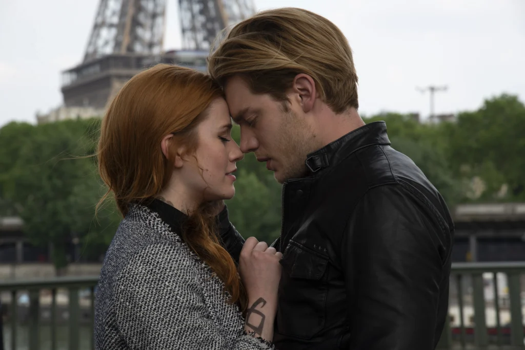 Jace and Clary embracing each other in Paris from the TV show Shadowhunters based on The Mortal Instruments.