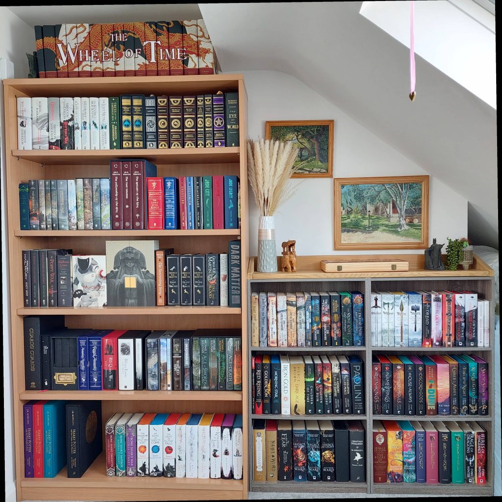 @fantasyphile image of two organized bookshelves with decorations