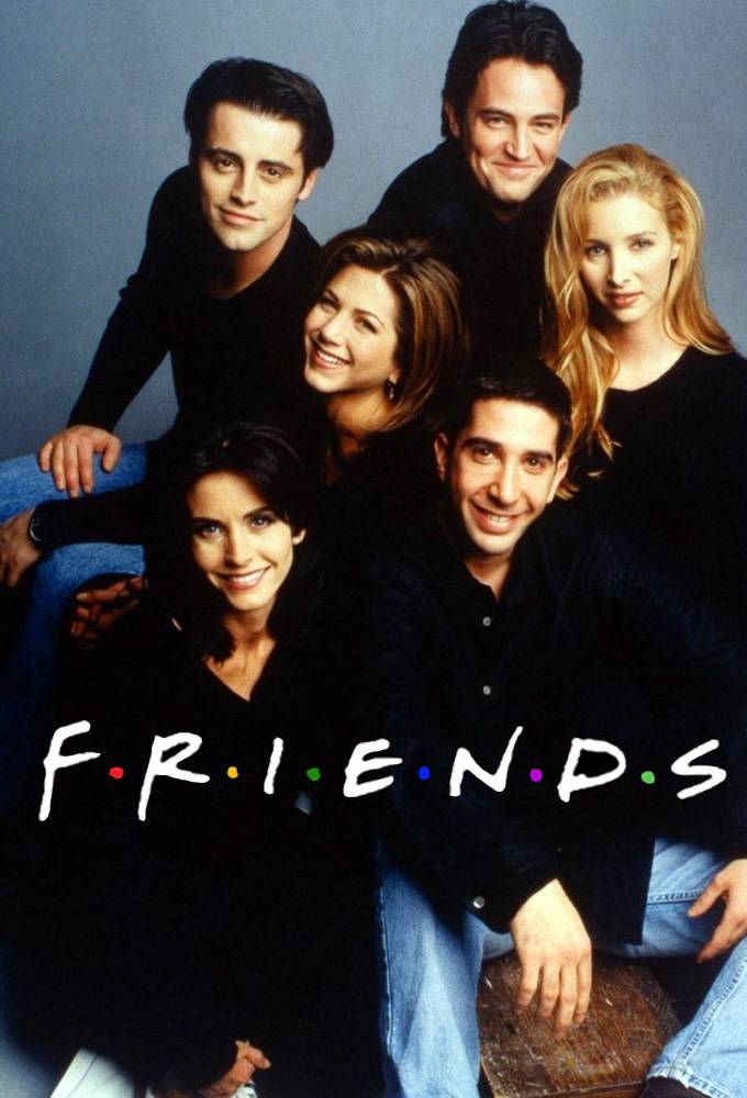 Friends cast sitting together and smiling