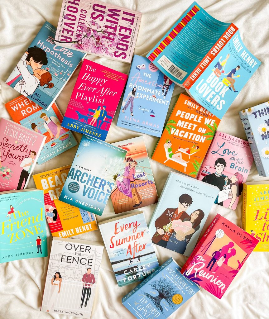colorful books scattered over a white sheet
