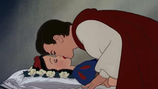 Prince in red cape kissing sleeping princess with black hair and red lips image
