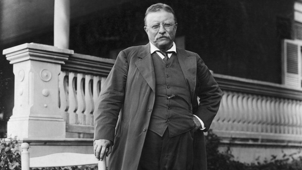 Roosevelt standing in fron of his Sagamore Hill home.