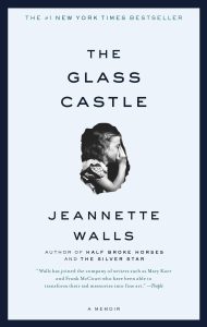 The Glass Castle cover by Jeannette Walls with a picture of a young girl on the front.