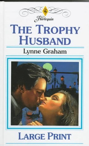 the trophy husband by lynne graham book cover
close up of a man and woman about to kiss, eyes closed very sensual. They could be outside or in front of a window because the moon and street lights are in the background