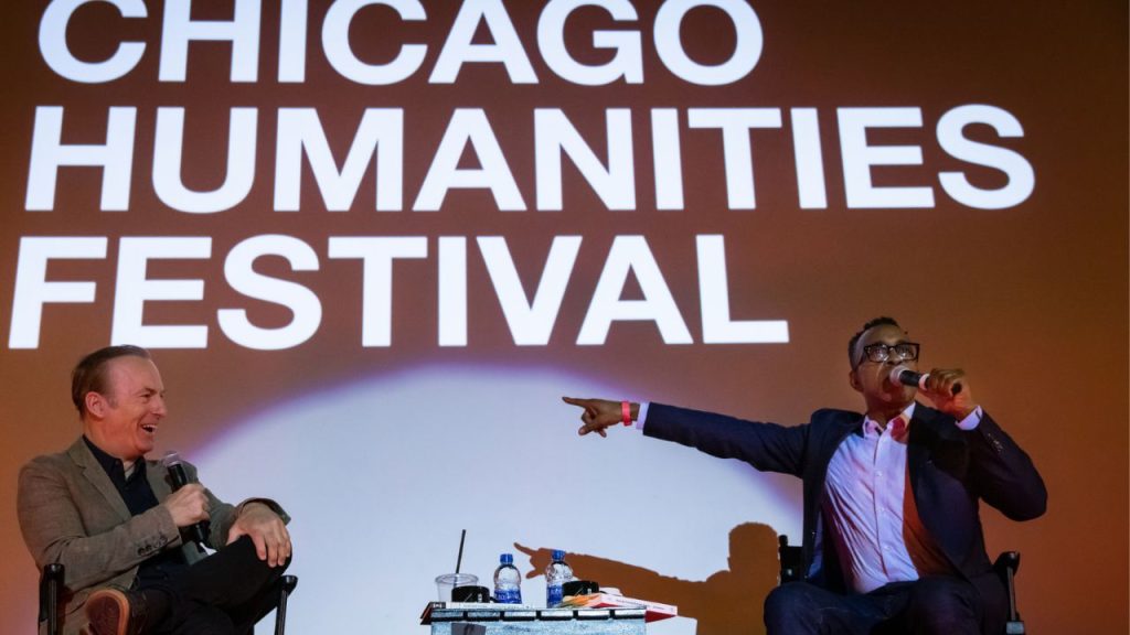 Chicago Humanities Festival panel with 2 men speaking with microphones
