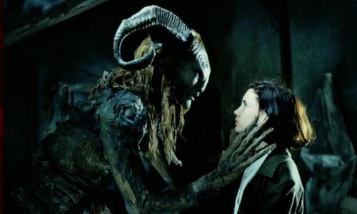 Pan's Labyrinth main protagonist and monster looking at each other