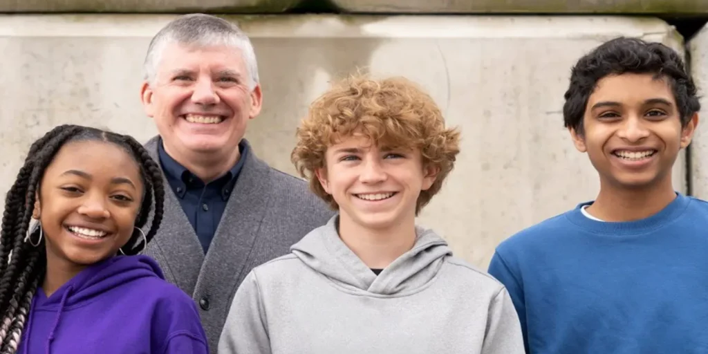 Author Rick Riordan standing with the three central actors for the Percy Jackson Disney+ Adaptation.