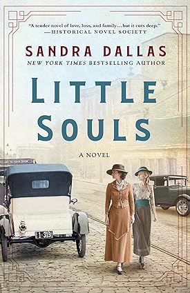 Little Souls by Sandra Dallas cover; two young women in old-fashioned hats and dresses walk down a cobblestone street next to a line of cars