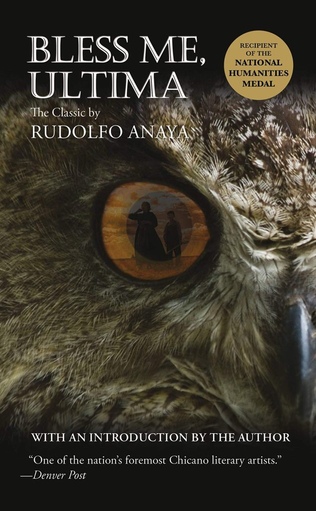 Bless Me, Ultima by Rudolfo Anaya cover; half of owl's face with woman and young boy reflected in its large eye