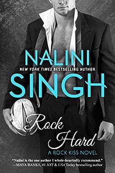 Rock Hard by Nalini Singh, Business man in open shirt suit holding a rugby ball.