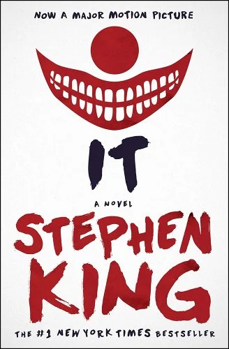 White cover and at the top is a clown nose with a large clown smile underneath. Text in the middle is the title it and beneath that is the author Stephen King.
