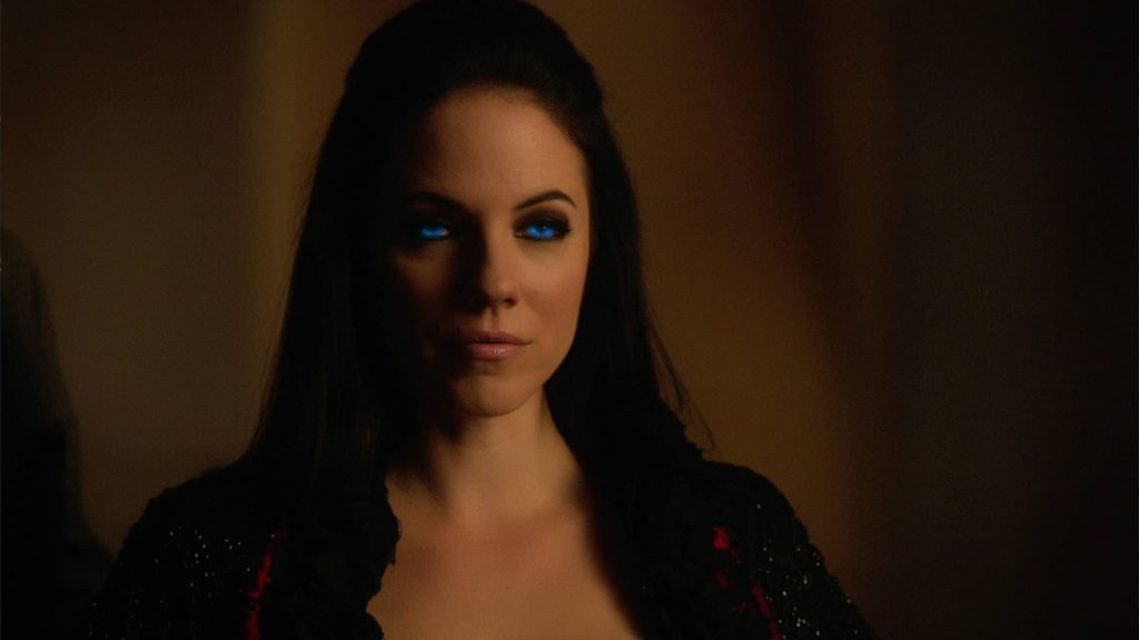Woman with glowing eyes, dark