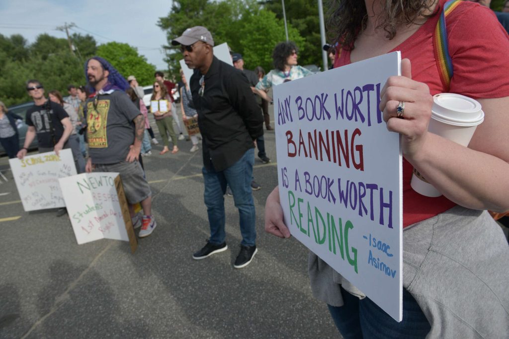 Newtown protestors rallying against banning books. Image via CT Insider