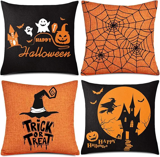 Halloween themed pillows. They feature images of ghosts, spider webs, and witch hats.