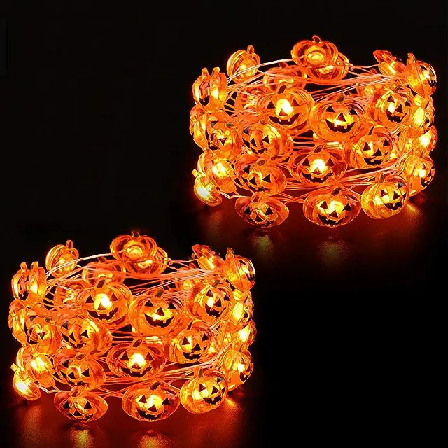 Two rings of orange halloween lights shaped like Jack o Lanterns.