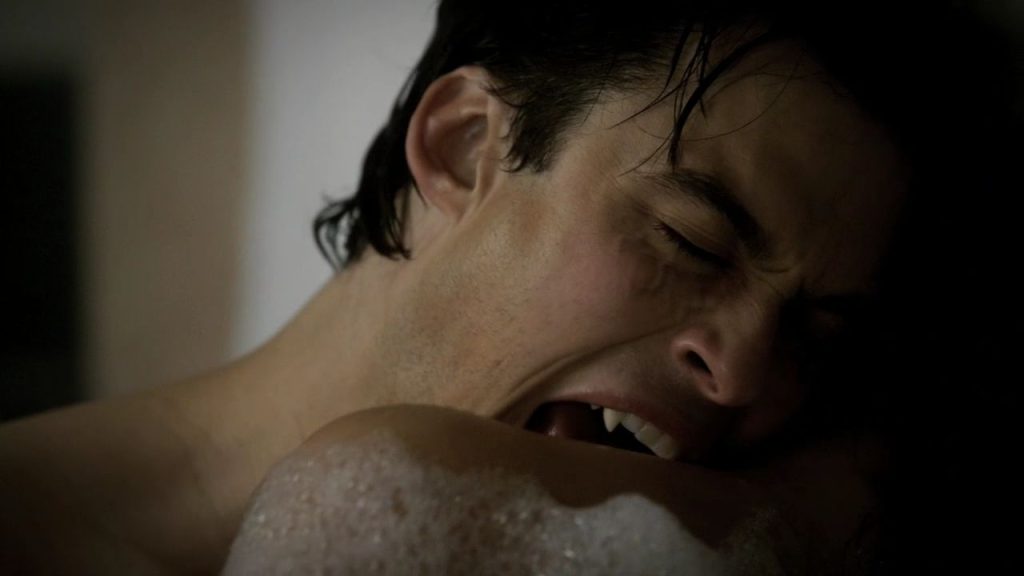 Damon biting someones neck in the bath