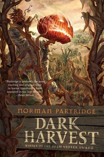 Dark Harvest by Norman Partridge book cover with a brown and green illustration of a cornfield with a monster with a burning jack-o-lantern face.