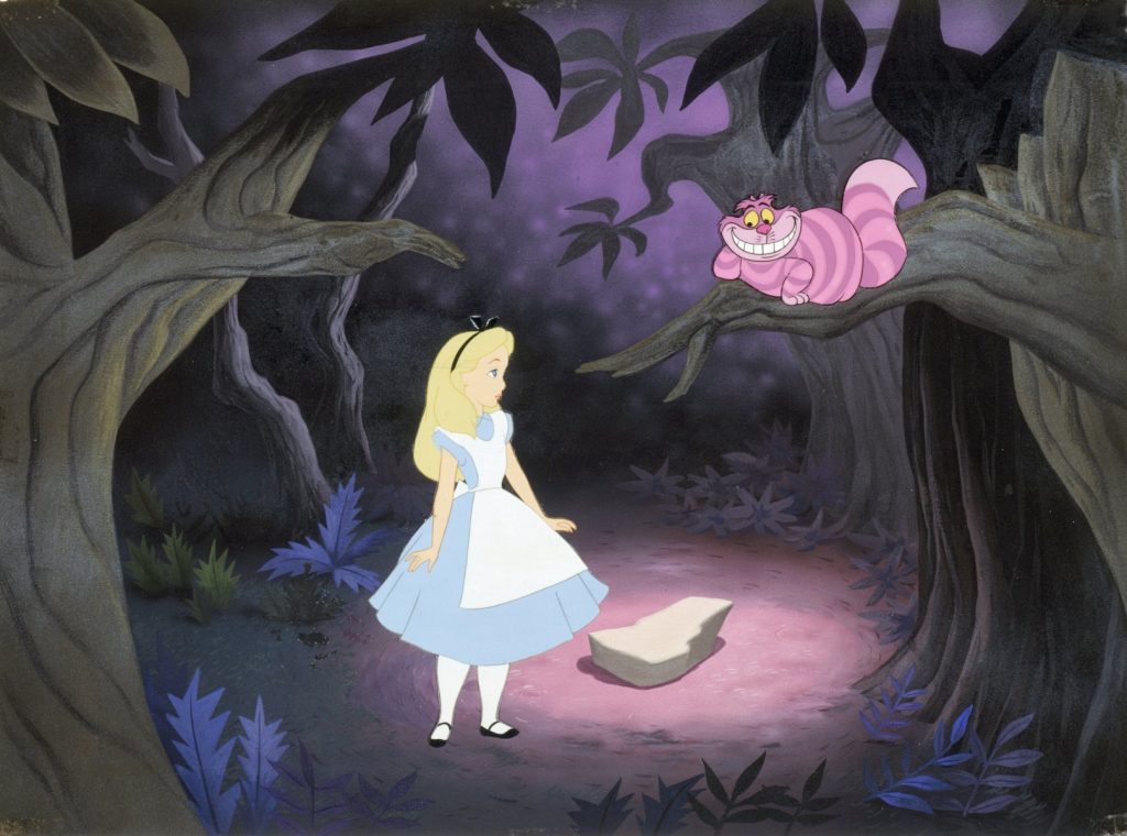 Alice in Wonderland cartoon movie with Alice in a blue dress looking at the pink and purple Cheshire Cat in a tree.