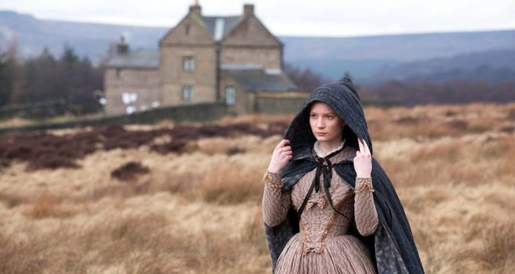 'Jane Eyre' 2011 movie showing Jane walking away and pulling her hood over her head