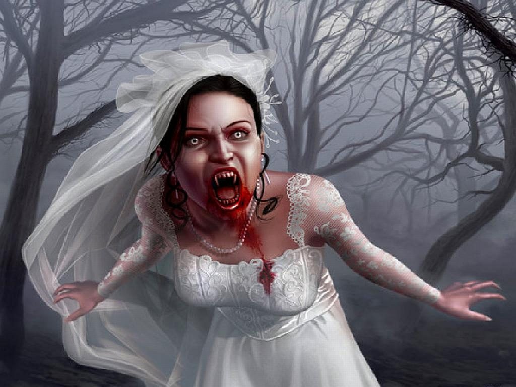 There's a vampire bride dressed in a white wedding gown and veil. Blood drips from her mouth and she has fangs. She's surrounded by gaunt trees at night, depicting a frightening scene.