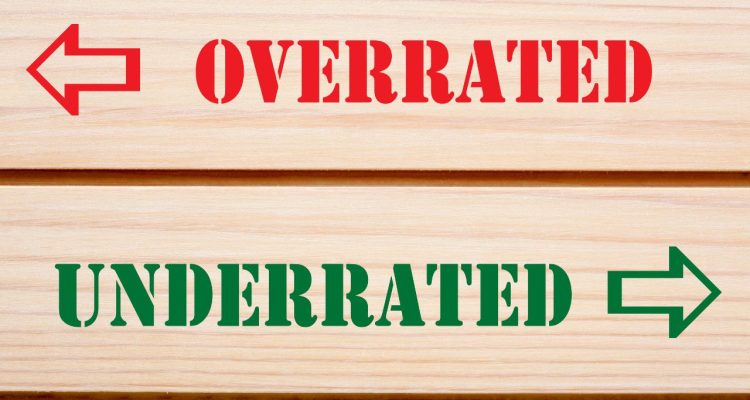 Sign that reads "overrated" with a left-facing arrow and "underrated" with a right-facing arrow.