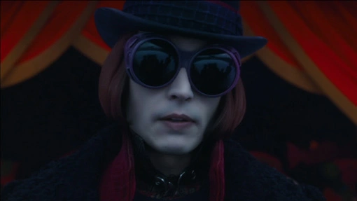 Willy Wonka in a pair of glasses and a hat.