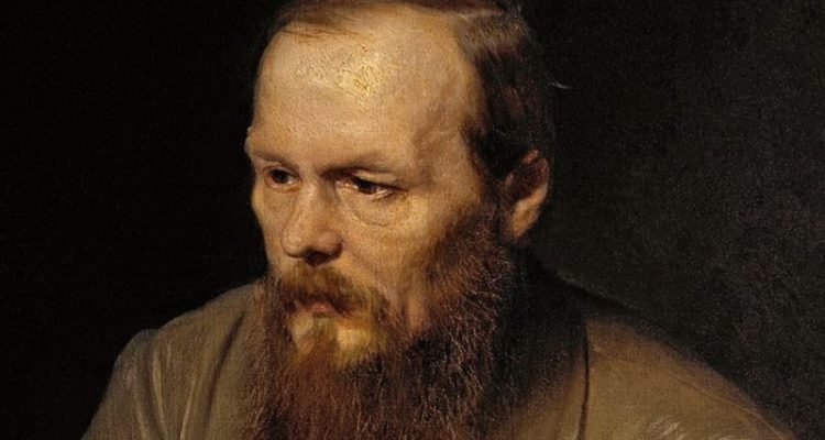 Oil portrait of Fyodor Dostoyevsky in front of a black background wearing a tan suit