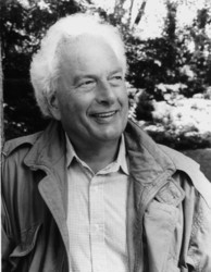 Black and white photo of Joseph Heller smiling and staring off camera