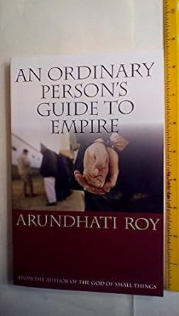 'An Ordinary Person's Guide to Empire' by Arundhati book cover showing a person handcuffed on the right and a lineup of people on the left