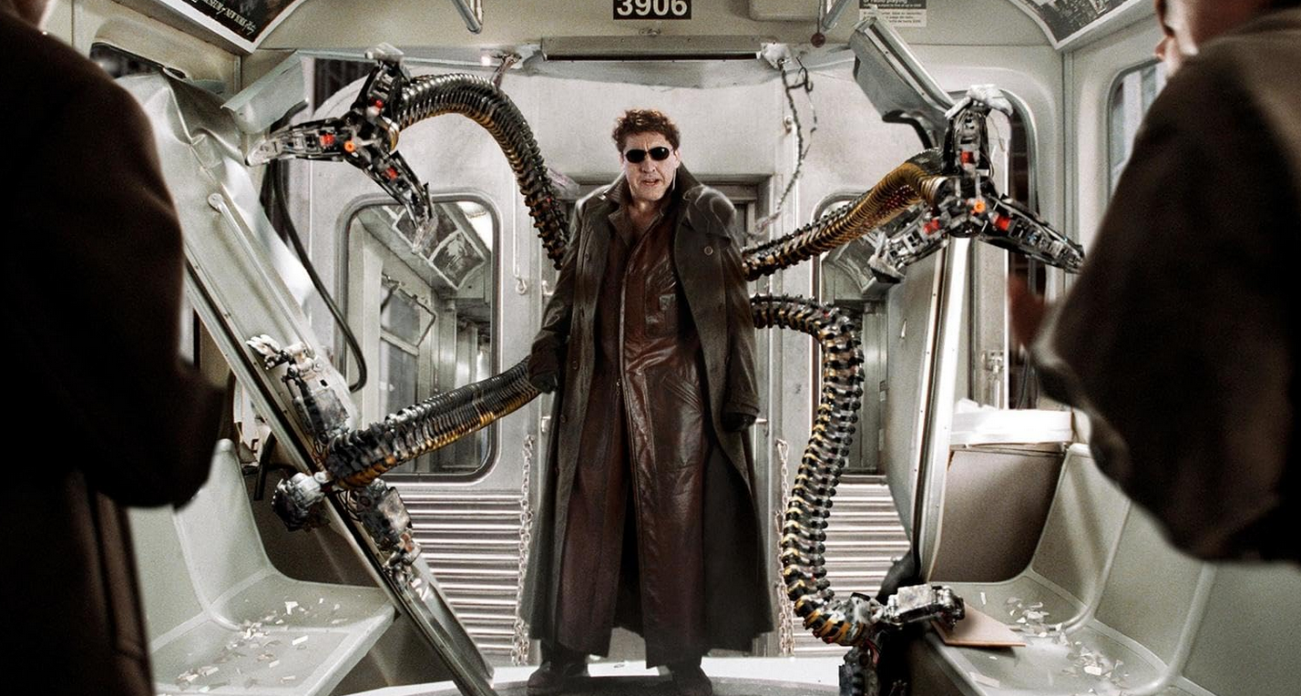Otto Octavius stands in a subway train with his four robotic limbs extended out, two of them reaching towards the camera and two others to support his stance.