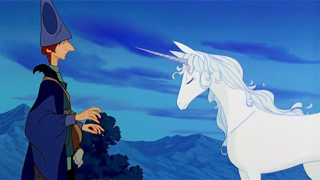 The last unicorn and Schmendrick the magician looking at each other.