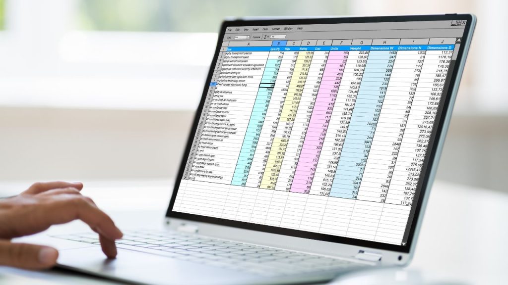 Color-coded spreadsheet on a laptop.
