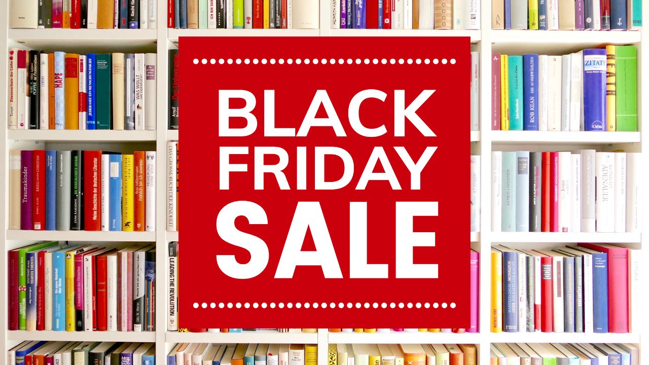 Red sign reading "Black Friday sale" in front of a colorful bookshelf.