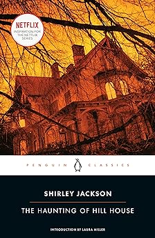 'The Haunting of Hill House' by Shirley Jackson book cover showing a large house through thin tree branches