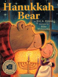Front cover of Hanukkah bear by Eric A. Kimmel, showing a bear licking a ladies face. 