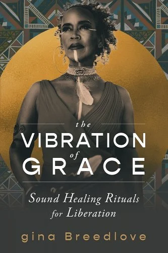 The Vibration of Grace cover by gina Breedlove, gina Breedlove looking off to the side as she stands in front of a gold background. 