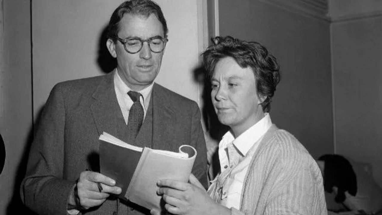 Harper Lee looking over the script for "To Kill A Mockingbird" with actor Gregory Peck.