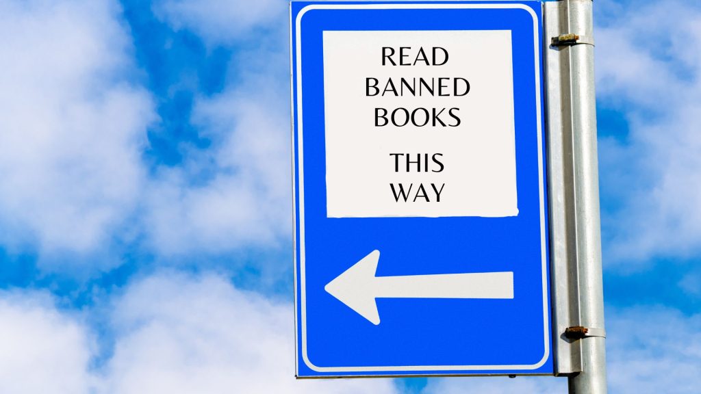 Sign that reads "Read Banned Books This Way"