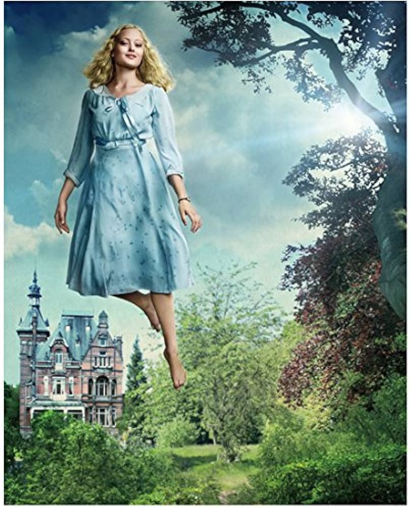 Emma from the movie Miss Peregrine's wearing a blue dress and floating in the air. 