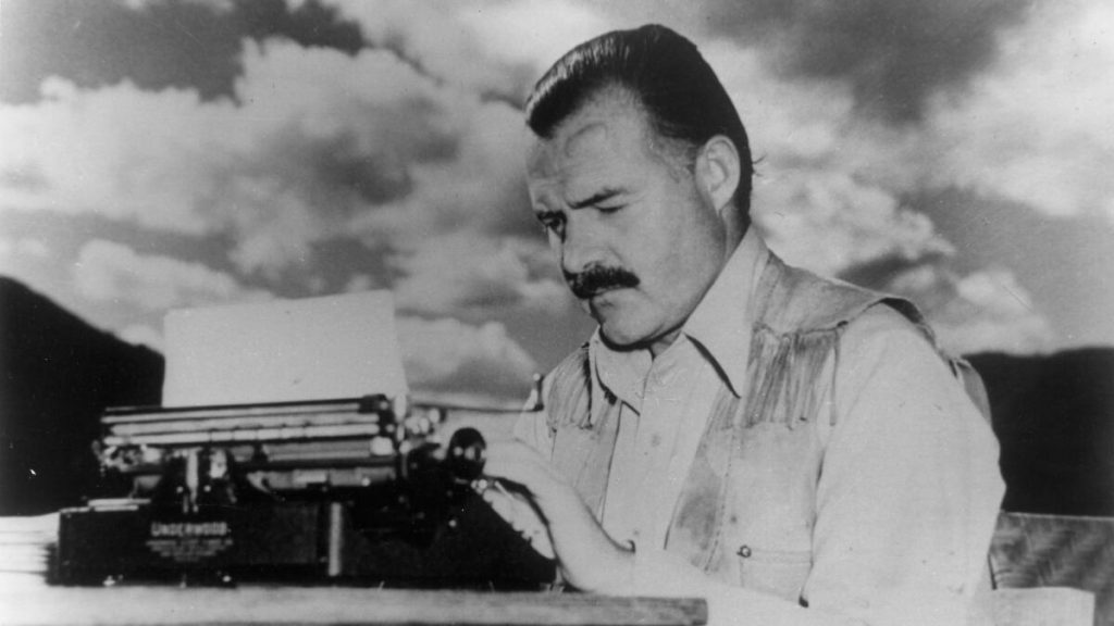Ernest Hemingway typing on an Underwood