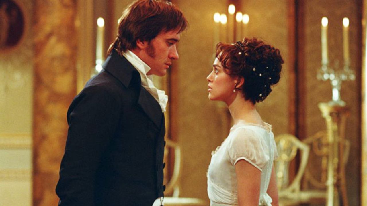 Elizabeth and Darcy standing close and staring at each other.